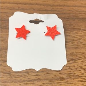 Faux leather stud earrings.